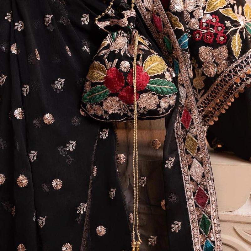 MAHNAAZ- Haseens official ( ORIGINAL)…4 pieces heavy embroidered chiffon suit with matching potli bag